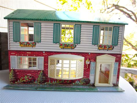 old metal doll houses 1960s|vintage tin doll houses 1960.